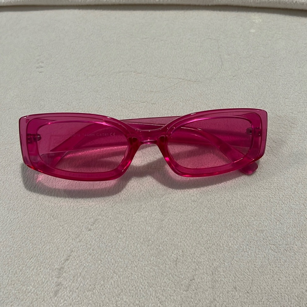 Pink clear rounded rectangle sunglasses.